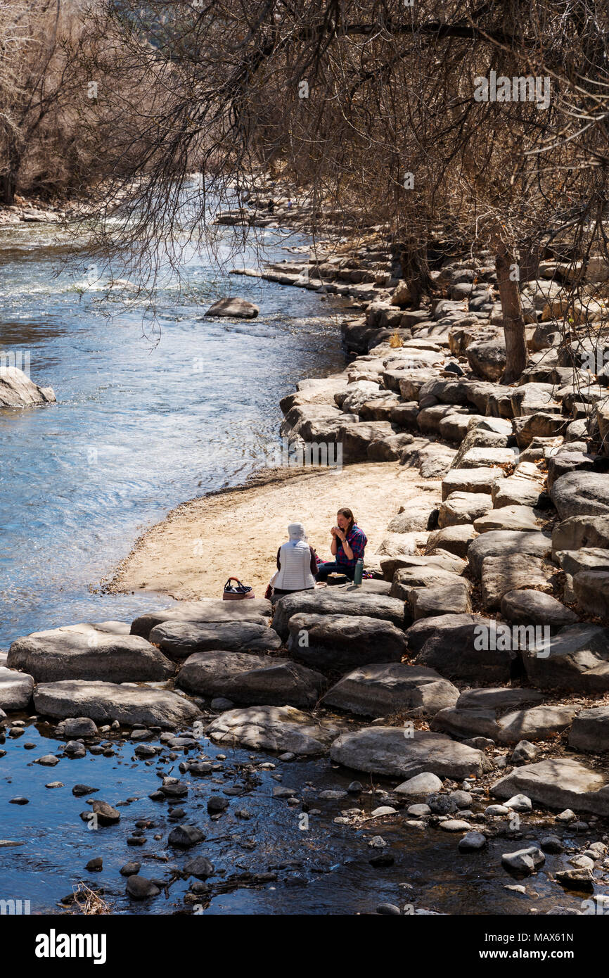 Visitors enjoying the Arkansas River on a springtime day; Salida; Colorado; USA Stock Photo