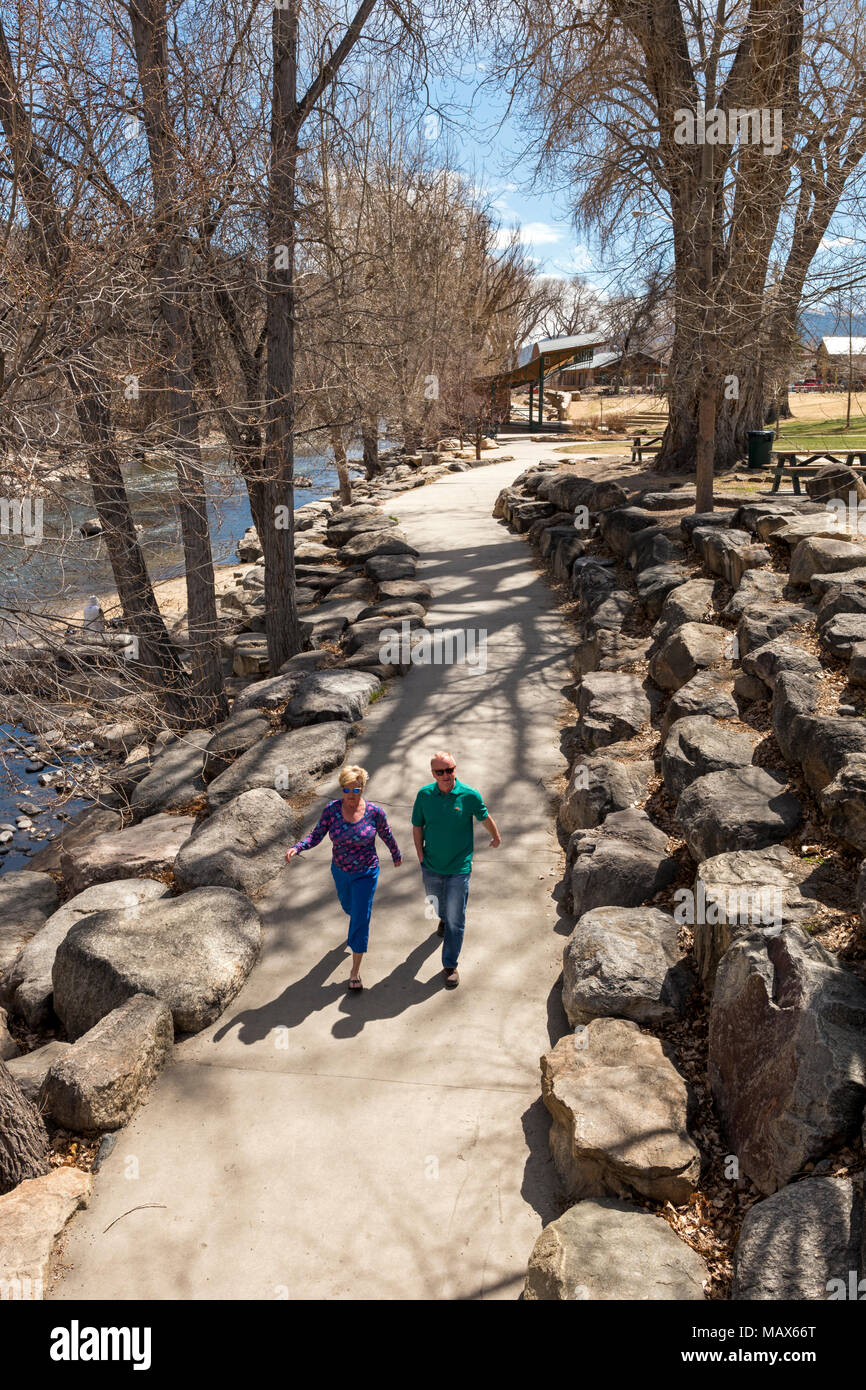 Visitors walking along the Arkansas River on a springtime day; Salida; Colorado; USA Stock Photo