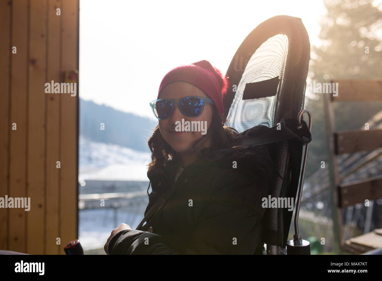 Teenager with sunglasses riding with roller coaster Stock Photo Alamy