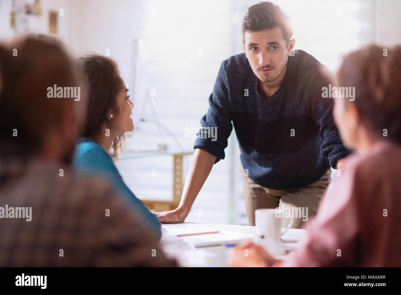 in a meeting. A young man presenting his project Stock Photo