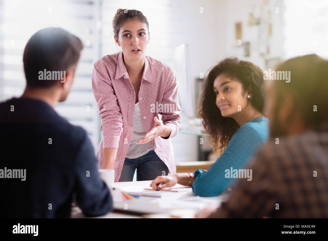 meeting office. young woman presents her project to her colleagues Stock Photo