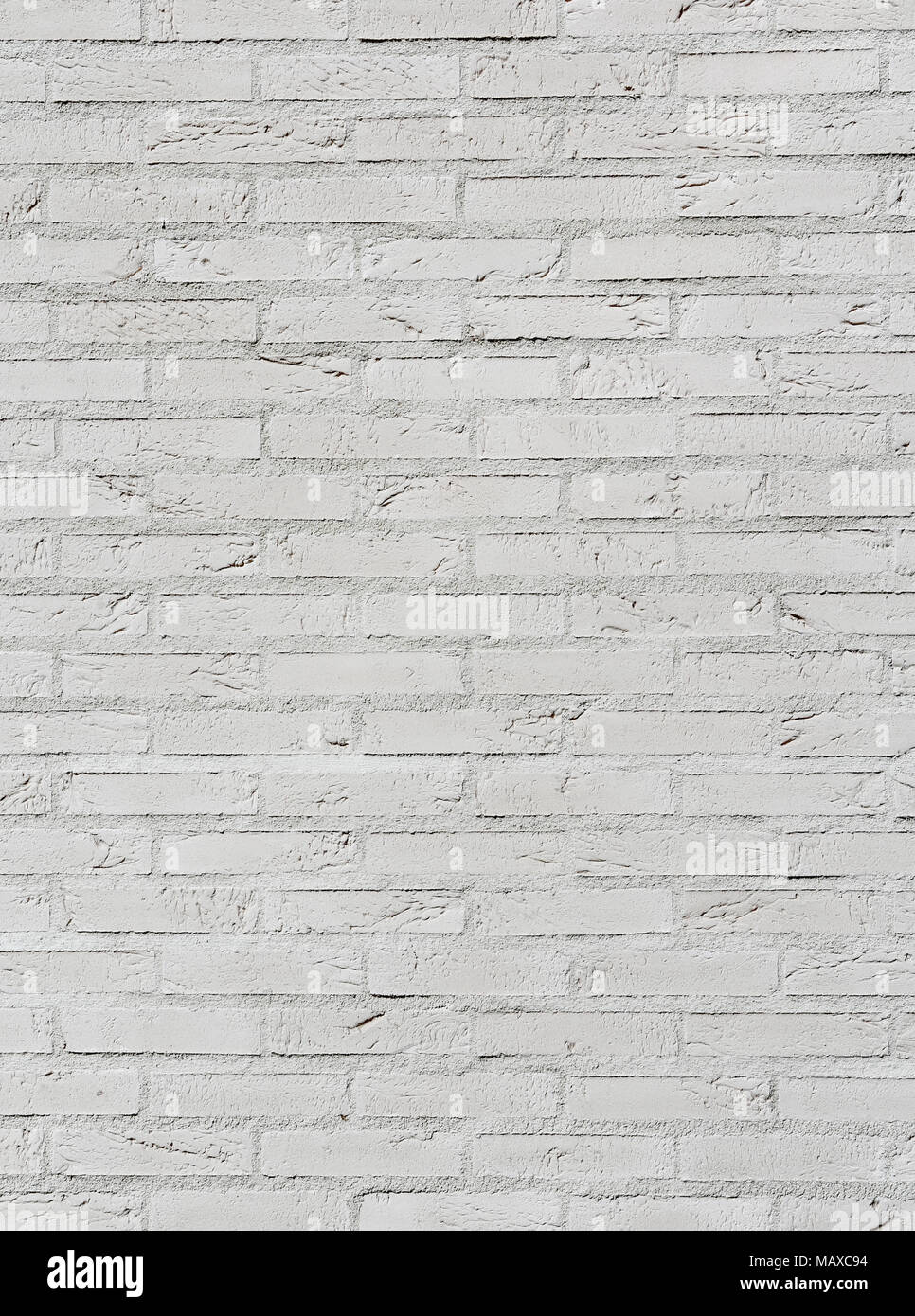Clean white brick wall with beautiful texture and a lot of horizontal lines of cement. Stock Photo