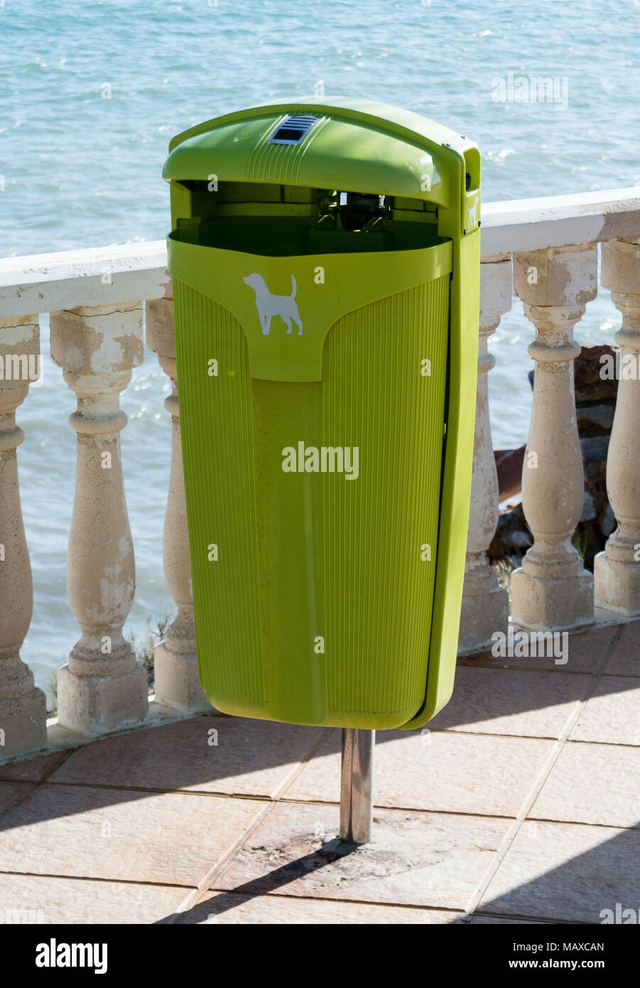 Green dog poo bin on sea front Stock Photo Alamy