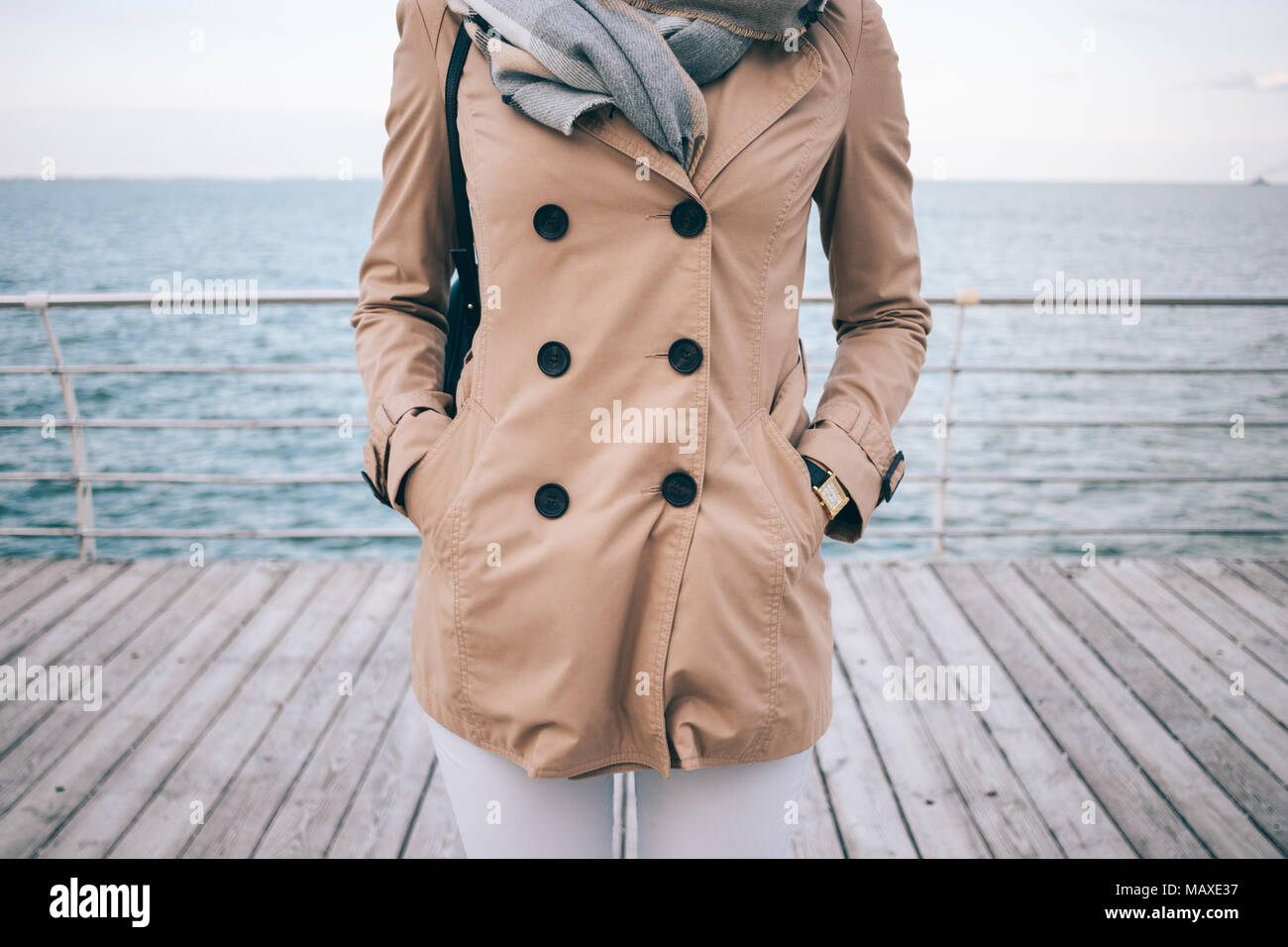 Thorough Souvenir Fourth Spring marine outfit. Fashionable girl standing on the waterfront. Cropped photo of slender young woman wearing beige trench coat, large scarf and gol Stock Photo - Alamy Thorough Souvenir Fourth Spring marine outfit. Fashionable girl standing on the waterfront. Cropped photo of slender young woman wearing beige trench coat, large scarf and gol Stock Photo - Alamy