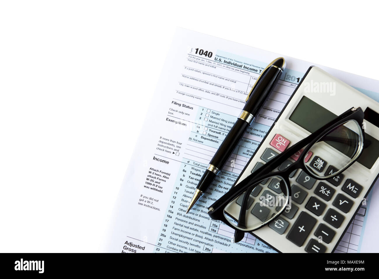 Tax Filing Top View Of Calculator Pen Eyeglasses And Out Of Focus U S Irs 1040 Form Stock Photo Alamy