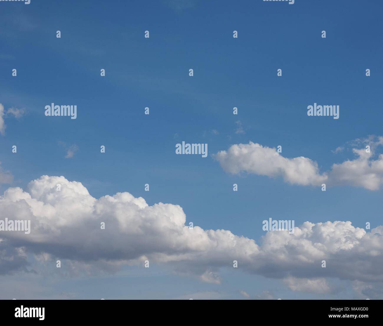 blue sky with clouds useful as a background Stock Photo - Alamy