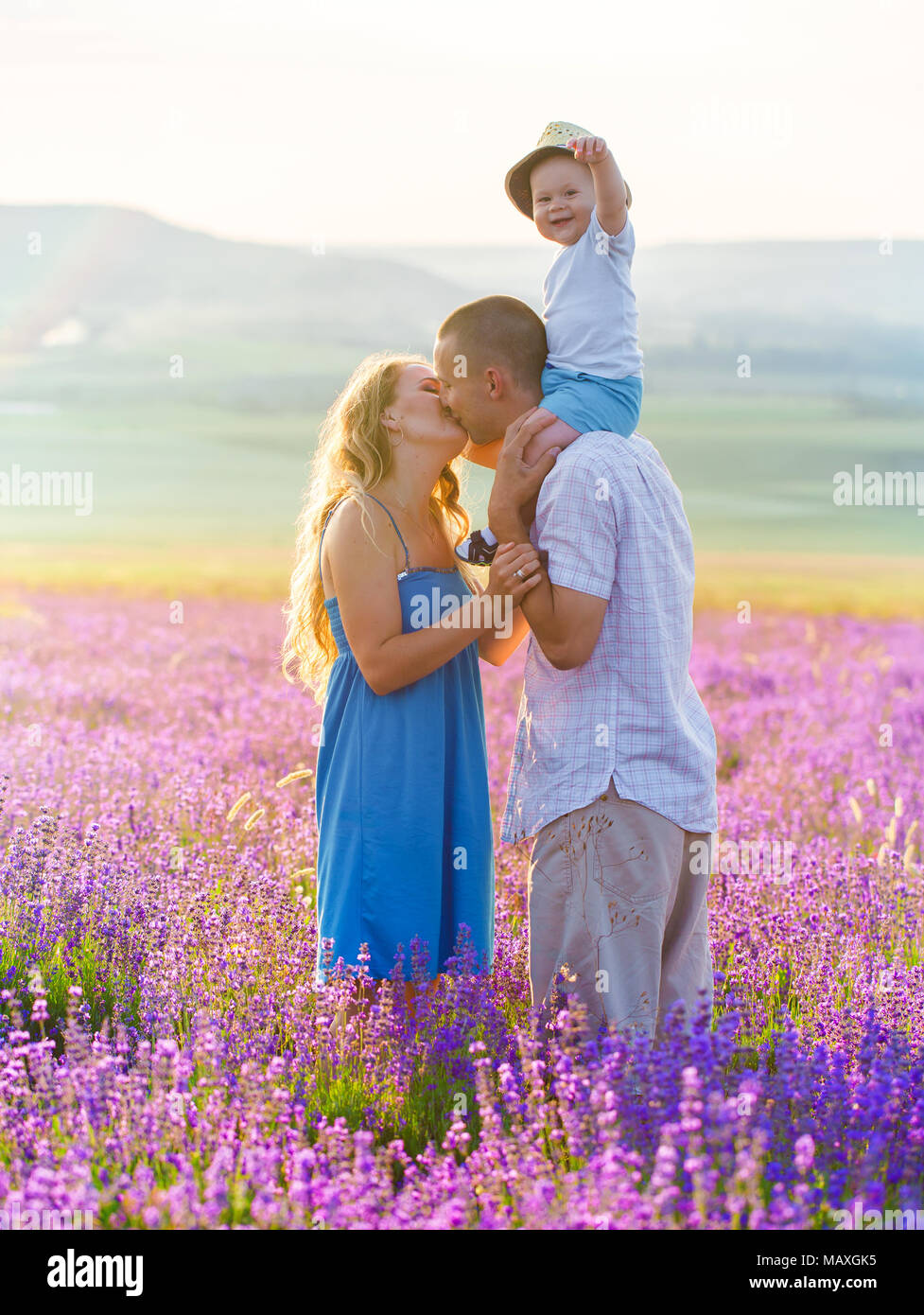 Young family in a lavender field Stock Photo - Alamy