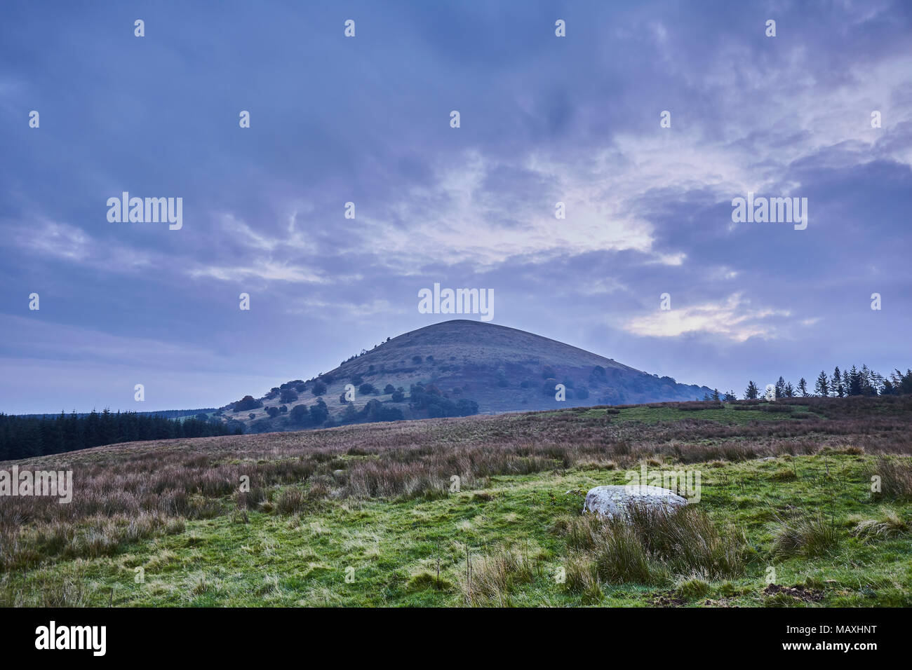 Great Mell Fell in an early autumn morning with storm clouds gathering, Lake District National Park, Cumbria, UK Stock Photo