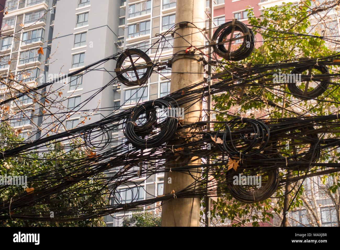 Interwined Electric Wires on  City Street in Xi'an, China, March 2018 Stock Photo