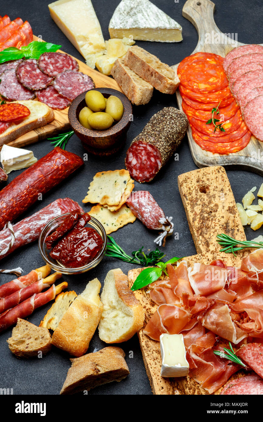 Italian meat appetizer snack set. Salami, prosciutto, bread, olives