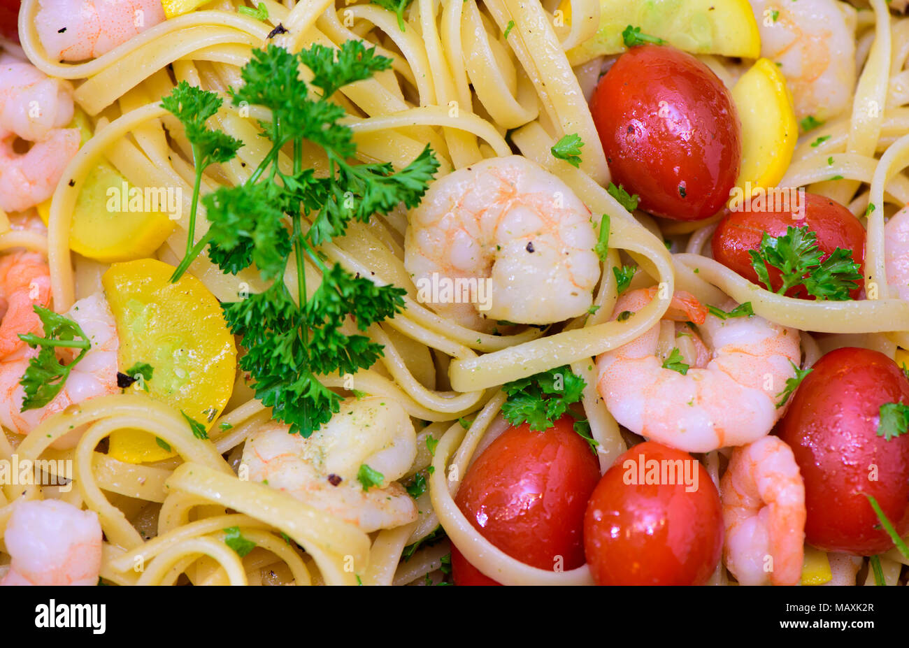 mediterran italian pasta with prawns and tomatoes Stock Photo