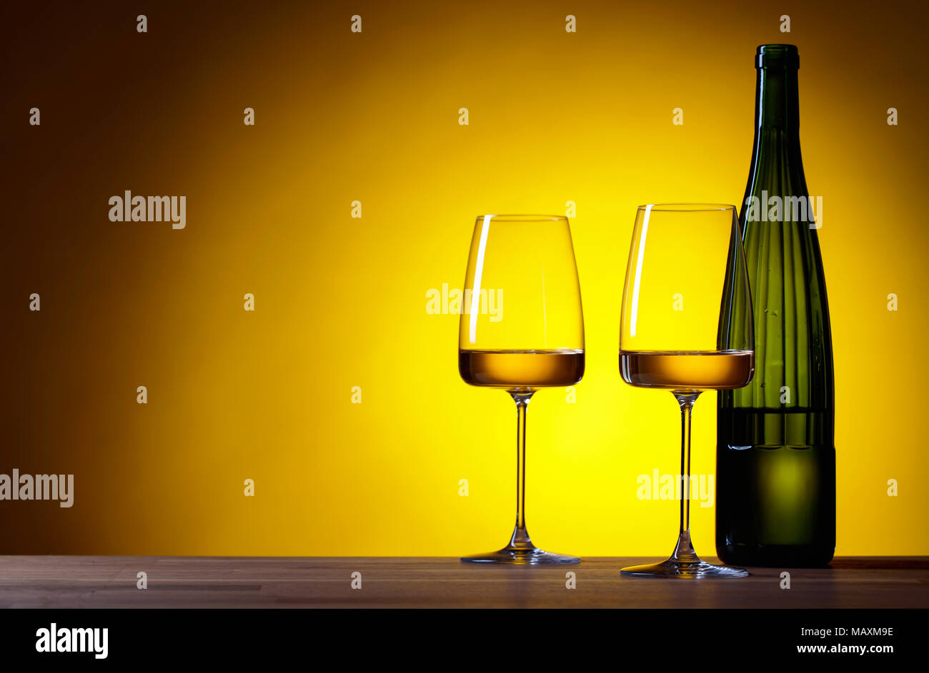 Download Glasses And Bottle Of White Wine On A Yellow Background Copy Space Stock Photo Alamy Yellowimages Mockups