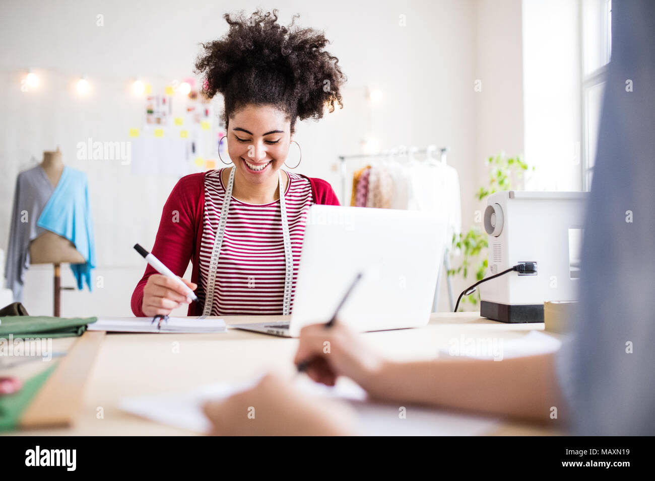 Young creative women in a studio, startup business. Stock Photo