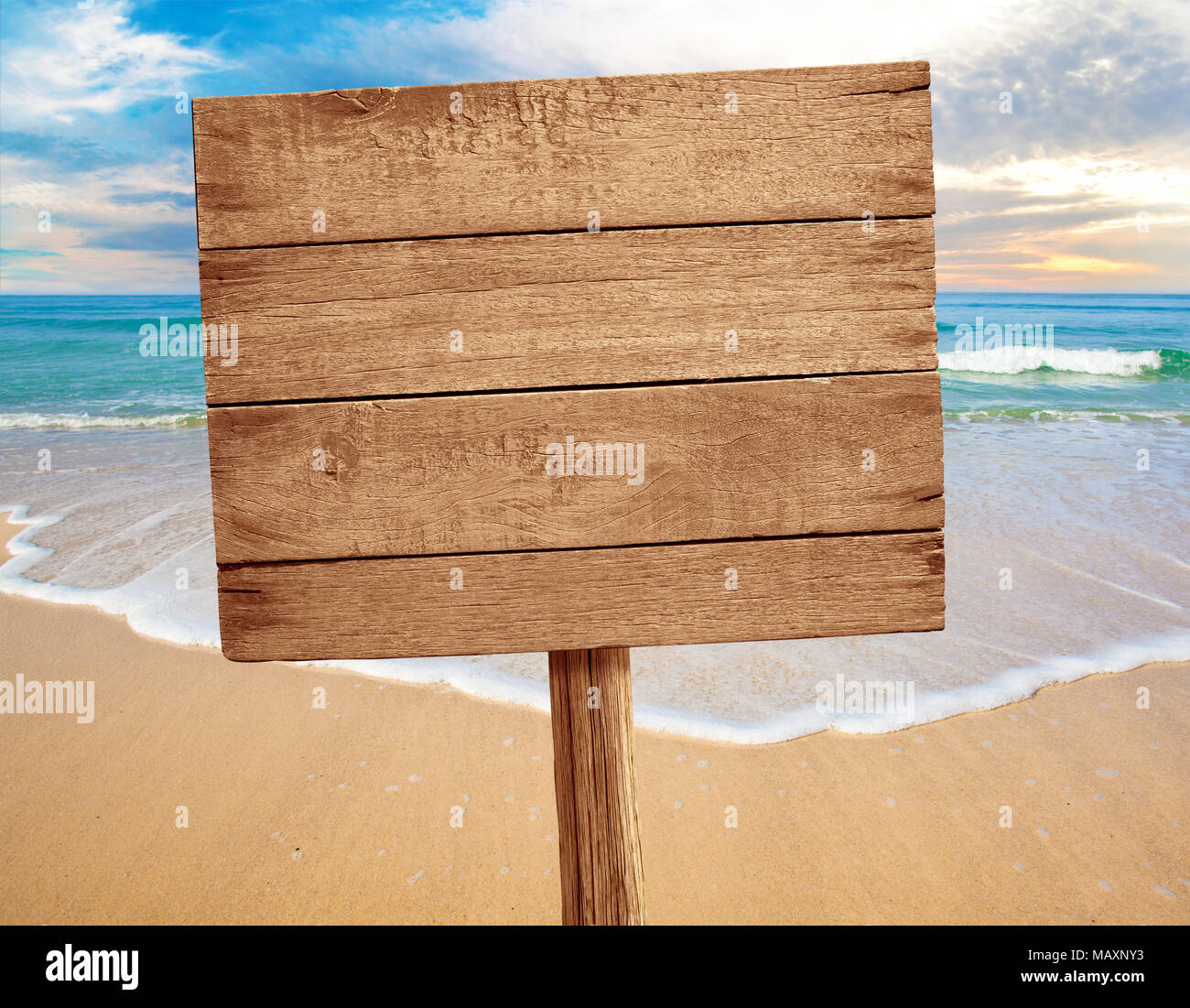 wood sign on beach background Stock Photo