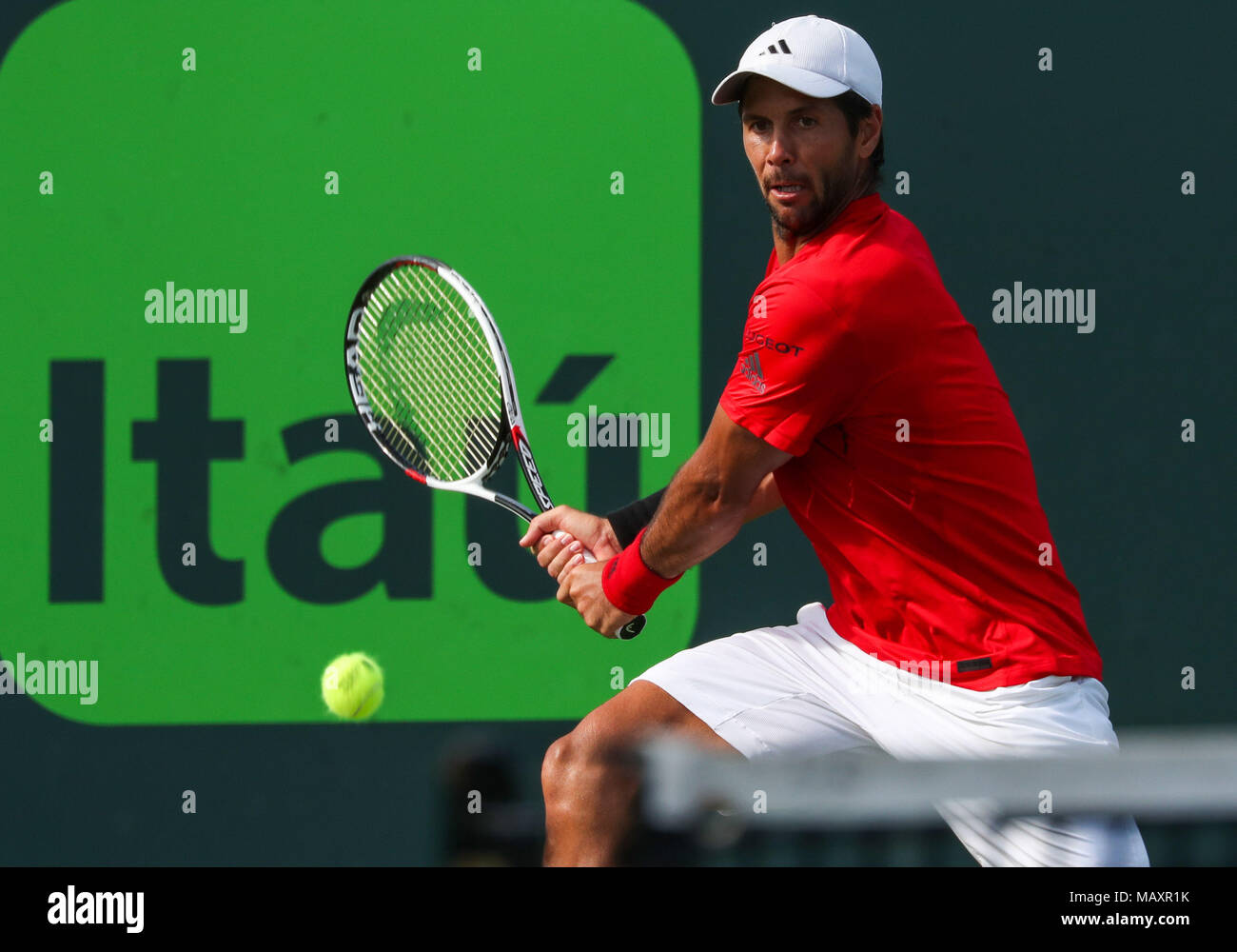 Key Biscayne, Florida, USA. 27th Mar, 2018. Fernando Verdasco of Spain plays a backhand against Pablo Carreno Busta of Spain during a fourth round match of the 2018 Miami Open presented by Itau professional tennis tournament, played at the Crandon Park Tennis Center in Key Biscayne, Florida, USA. Mario Houben/CSM/Alamy Live News Stock Photo
