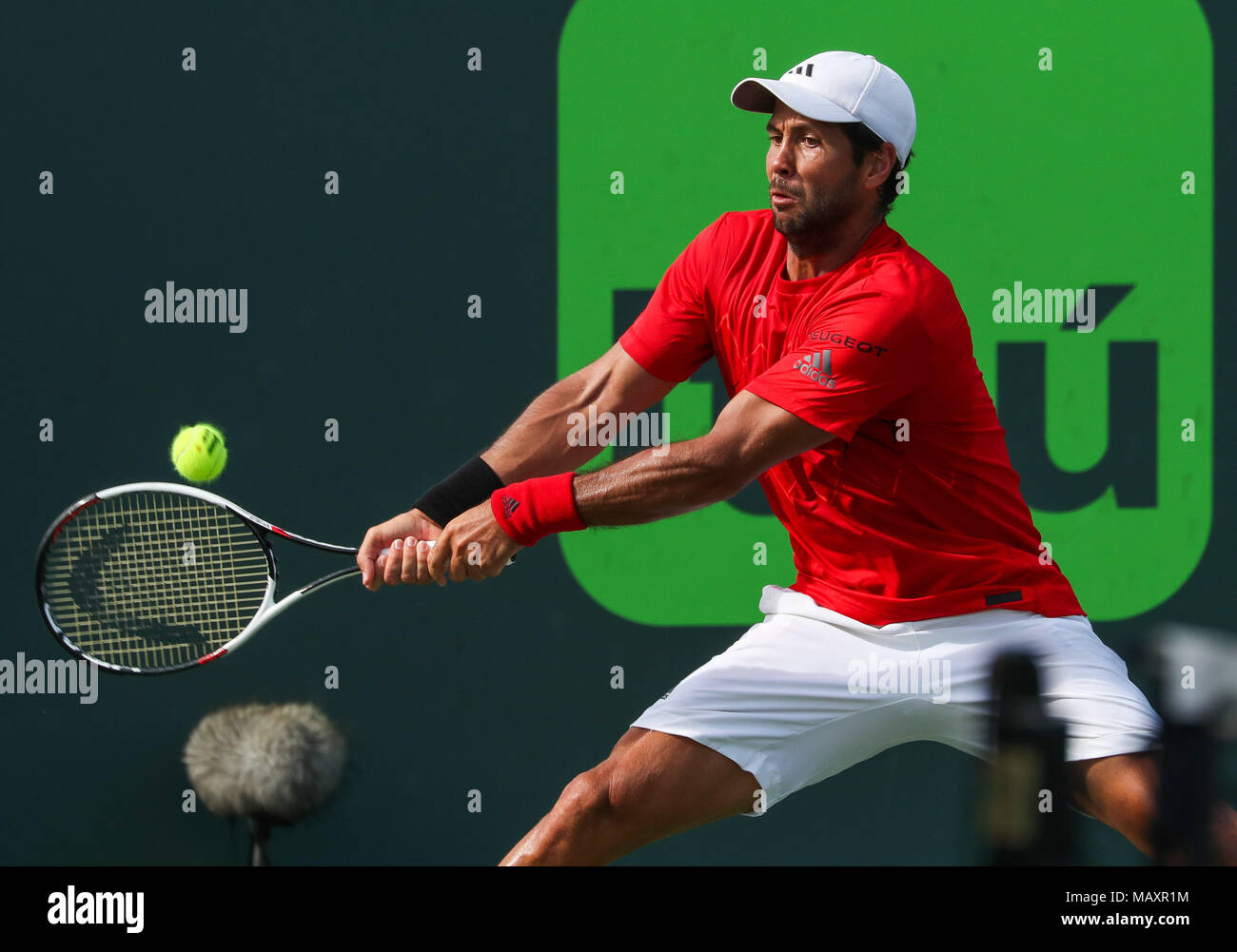 Key Biscayne, Florida, USA. 27th Mar, 2018. Fernando Verdasco of Spain plays a backhand against Pablo Carreno Busta of Spain during a fourth round match of the 2018 Miami Open presented by Itau professional tennis tournament, played at the Crandon Park Tennis Center in Key Biscayne, Florida, USA. Mario Houben/CSM/Alamy Live News Stock Photo