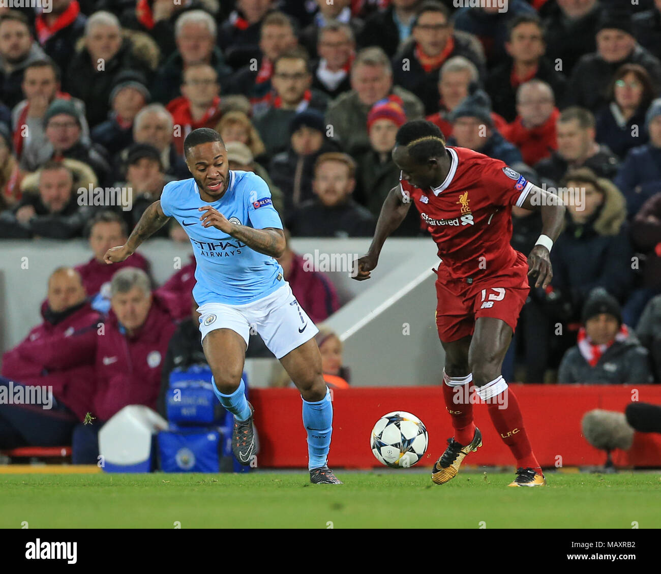 4th April 2018 , Anfield, Liverpool, England; Champions League Quarter Final, first leg, Liverpool v Manchester City; Sadio Mane of Liverpool slips Raheem Sterling of Manchester City Stock Photo