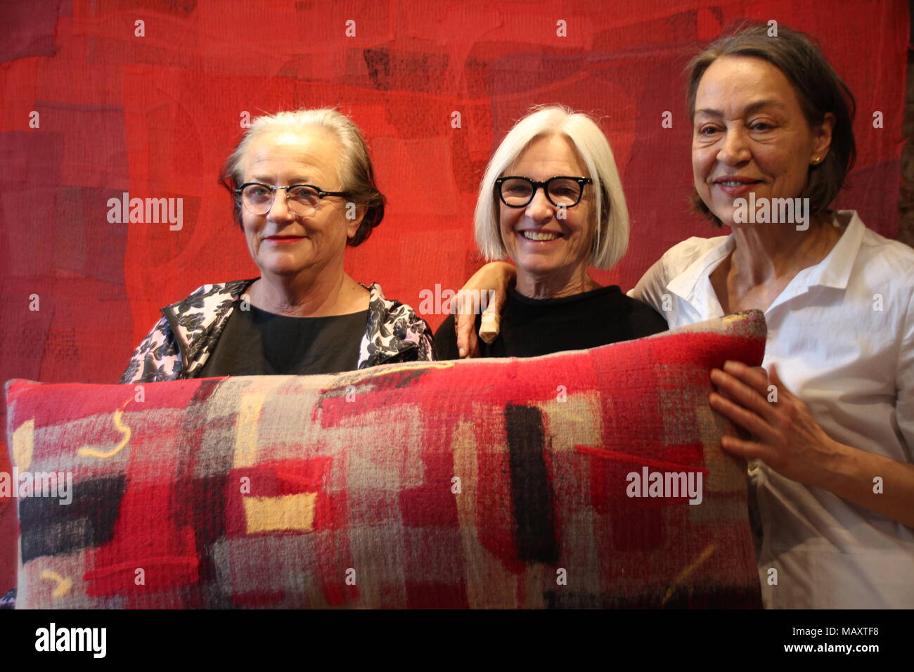 28 March 2018, US, New York: Designer Eileen Fisher (c) and project co-founders Lidewij Edelkoort (l) and Sigi Ahl present their programme 'DesignWork', which aims to turn discarded clothing into something new, whether it be pillows, bags or art. Discarded clothes make up 8% of the city's total waste. Photo: Christina Horsten/dpa Stock Photo