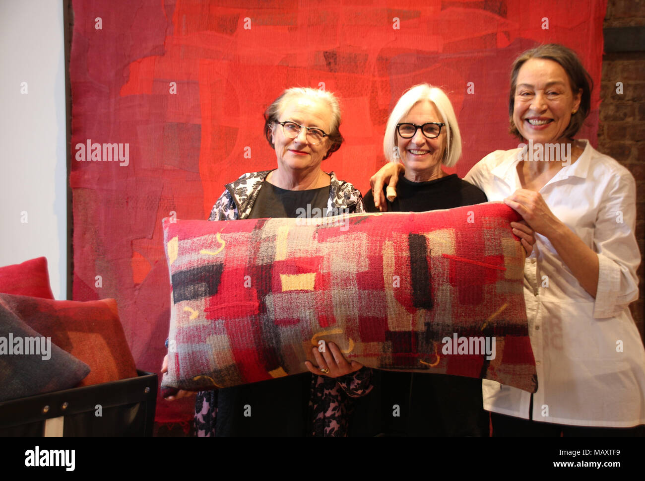 28 March 2018, US, New York: Designer Eileen Fisher (c) and project co-founders Lidewij Edelkoort (l) and Sigi Ahl present their programme 'DesignWork', which aims to turn discarded clothing into something new, whether it be pillows, bags or art. Discarded clothes make up 8% of the city's total waste. Photo: Christina Horsten/dpa Stock Photo