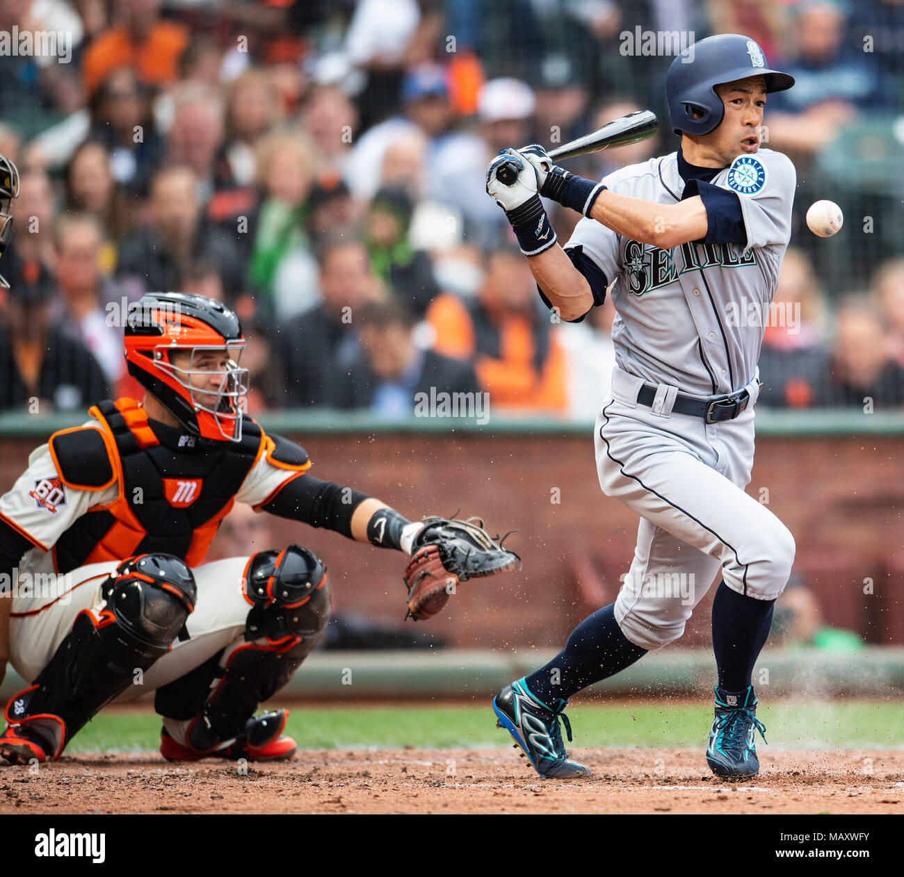 Jun 03, 2001; Oakland, CA, USA; Seattle Mariners' Ichiro Suzuki, #51,  throws his bat as he runs to first base after hitting a grounder in the  first inning against the Oakland Athletics