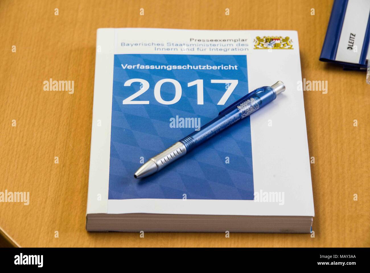 Munich, Bavaria, Germany. 5th Apr, 2018. The 2017-2018 edition of the Bavarian Verfassungsschutzbericht (Office for the Protection of the Constitution, Secret Service) report was released detailing threats to the state of Bavaria, including right- and left-extremism, Islamists, as well as Cyber Warfare and Espionage. The report introduced by Bavarian Innenminister Joachim Herrmann (CSU) and Dr. Burkhard KÃ¶rner, as well as .In recent years, Bavaria has seen a sharp rise in what is known as PMK-Rechts (politically motivated crimes- right wing) due to the Refugee Crisis. The Gruenen (Green P Stock Photo