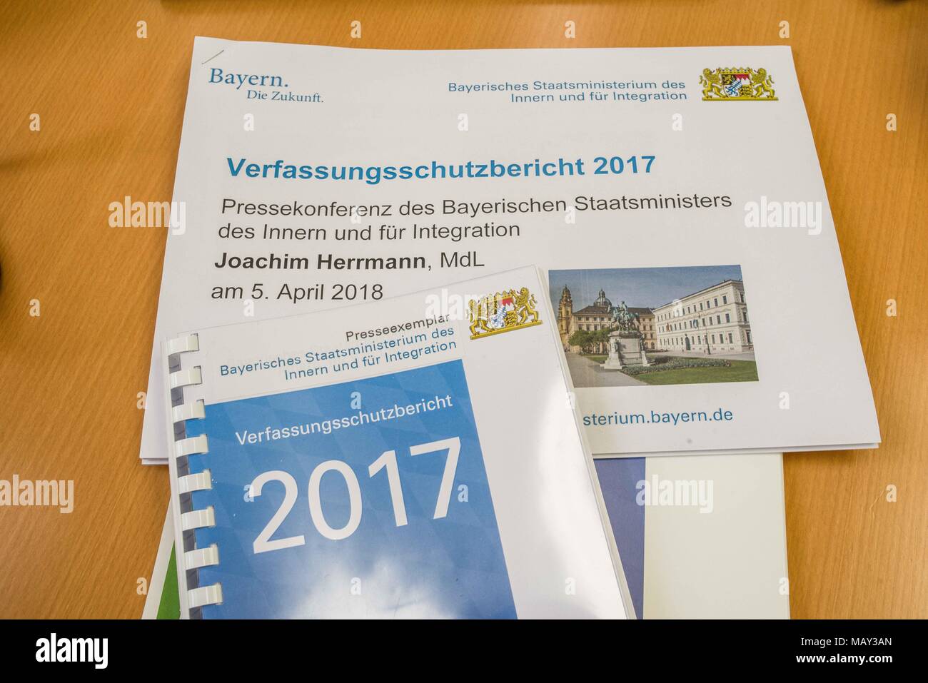 Munich, Bavaria, Germany. 5th Apr, 2018. The 2017-2018 edition of the Bavarian Verfassungsschutzbericht (Office for the Protection of the Constitution, Secret Service) report was released detailing threats to the state of Bavaria, including right- and left-extremism, Islamists, as well as Cyber Warfare and Espionage. The report introduced by Bavarian Innenminister Joachim Herrmann (CSU) and Dr. Burkhard KÃ¶rner, as well as .In recent years, Bavaria has seen a sharp rise in what is known as PMK-Rechts (politically motivated crimes- right wing) due to the Refugee Crisis. The Gruenen (Green P Stock Photo