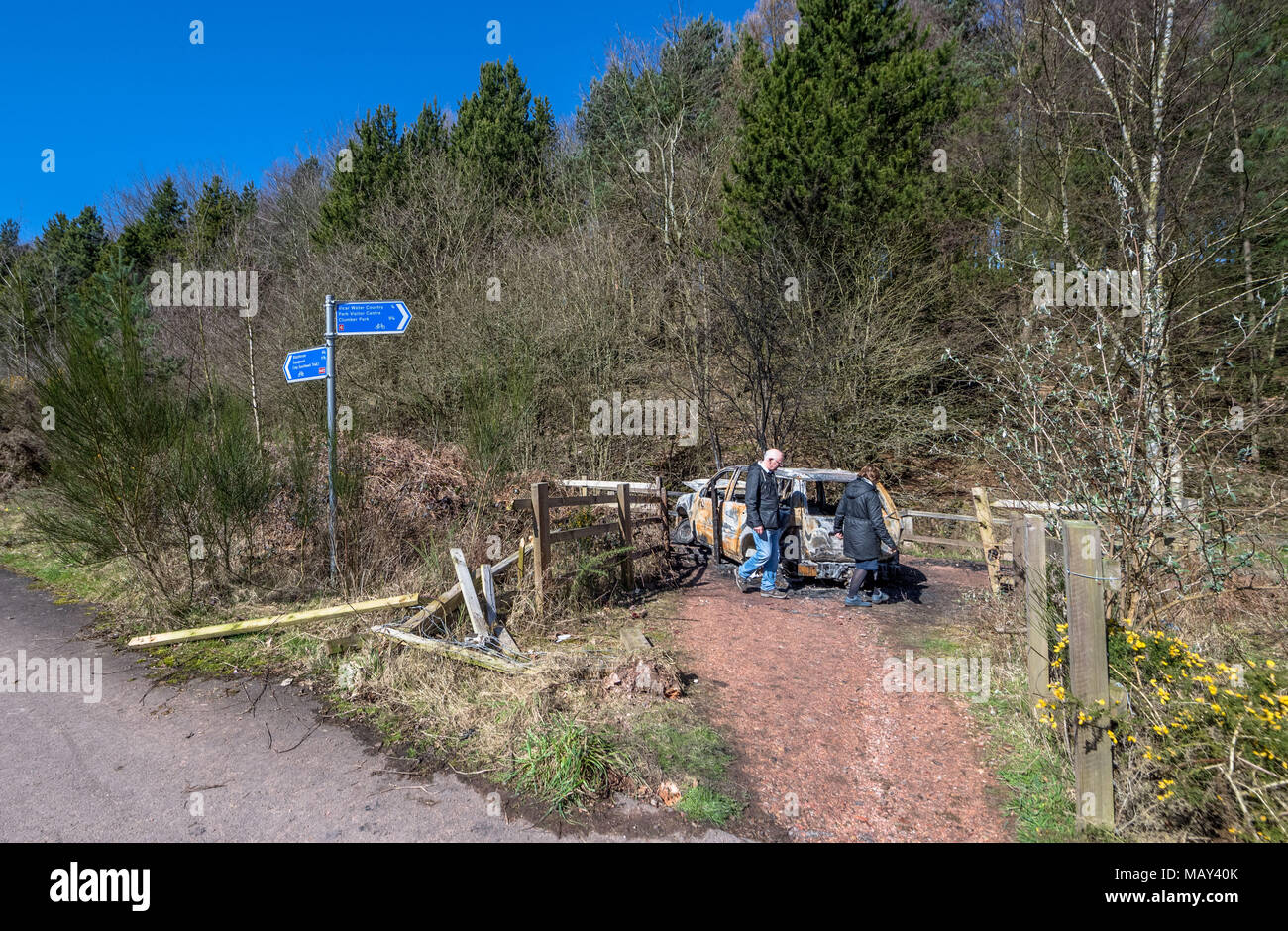 Sherwood Forest, Nottinghamshire, England, UK. 5th. April, 2018.  Burnt out vehicle blocking a woodland path for walkers on a warm and sunny Spring day. Alan Beastall/ Alamy Live News Stock Photo
