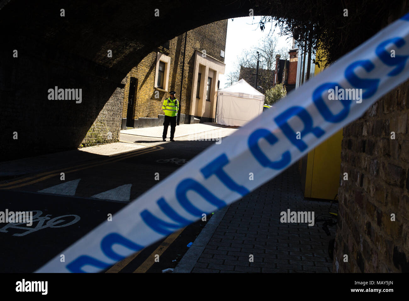 London UK 5th April 2018 Police at the scene where  Israel Ogunsolaaged 20, collapsed after being fatally stabbed last night near Link Street, Hackney. Credit: Thabo Jaiyesimi/Alamy Live News Stock Photo