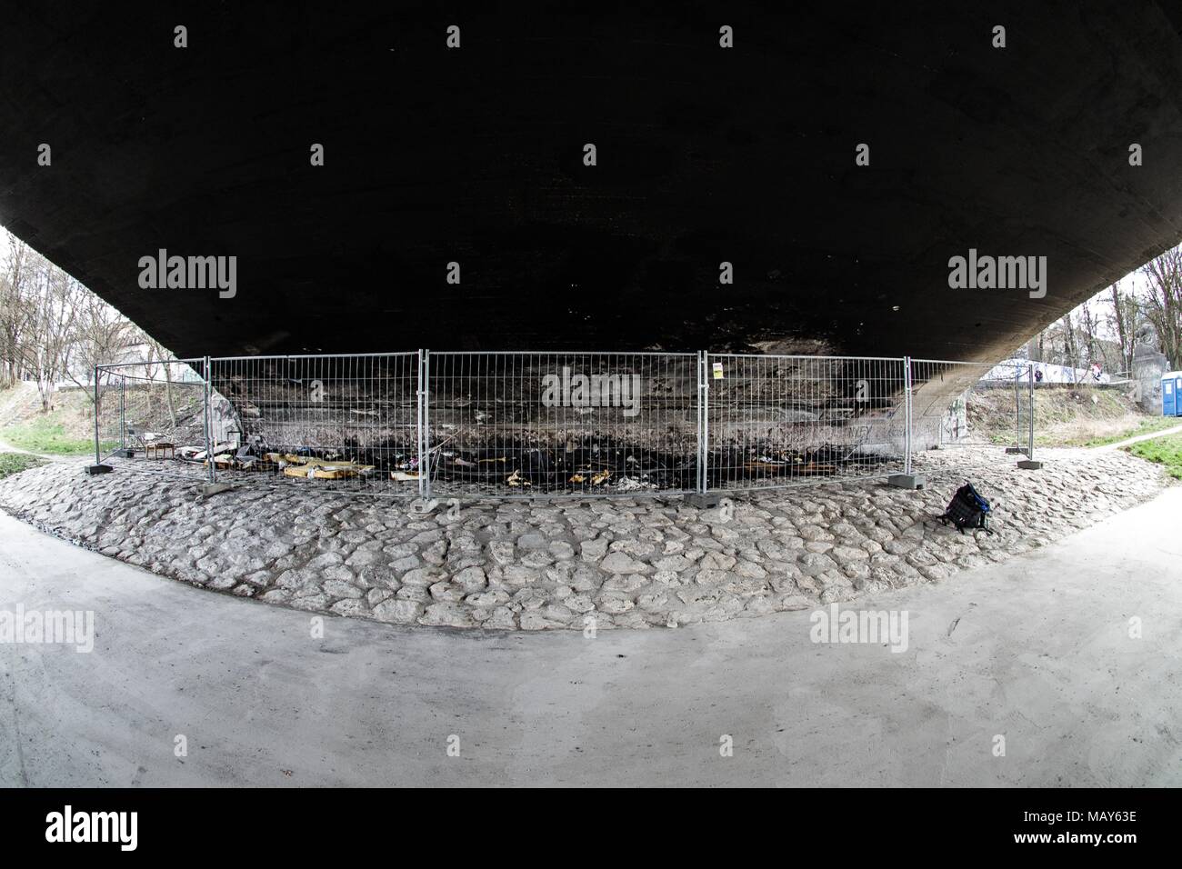 April 5, 2018 - MÃ¼Nchen, Bayern, Germany - A homeless camp under the ReichenbachbrÃ¼cke (Reichenbach Bridge) in Munich was the target of a suspected arson attack. The photos display the aftermath and the blackening of the surfaces of the bridge, as well as intense heat melting mattresses down to their springs. Damage to the bridge is estimated at 25,000 Euros. Four men, ages 24-53 were living there and unharmed. The suspects may have been two men who were standing near the fire and throwing objects into it. Credit: Sachelle Babbar/ZUMA Wire/Alamy Live News Stock Photo