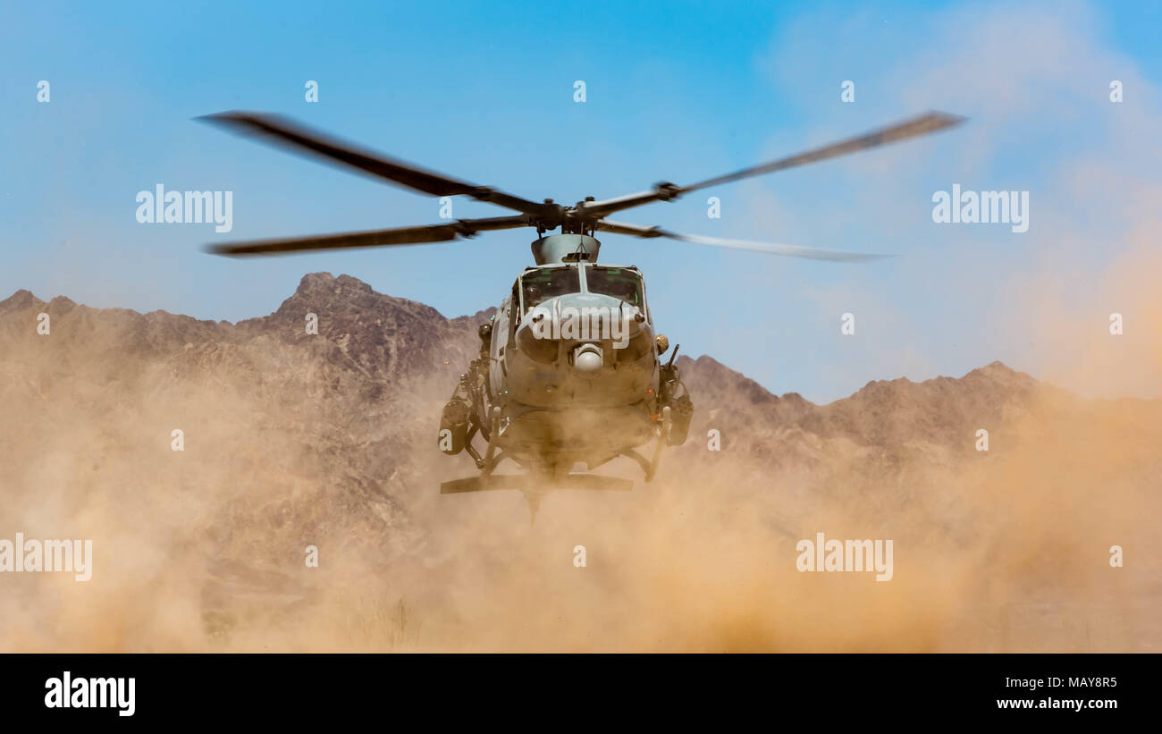 A U.S. Marine Corps UH-1Y Venom assigned to Marine Aviation Weapons and Tactics Squadron 1 lands at Bull Attack Forward Arming and Refueling Point in support of Weapons and Tactics Instructor Course 2-18 at Chocolate Mountain Aerial Gunnery Range, Calif., Aug. 2. WTI is a seven-week training event hosted by Marine Aviation Weapons and Tactics Squadron 1 cadre, which emphasizes operational integration of the six functions of Marine Corps aviation in support of a Marine Air Ground Task Force and provides standardized advanced tactical training and certification of unit instructor qualifications  Stock Photo