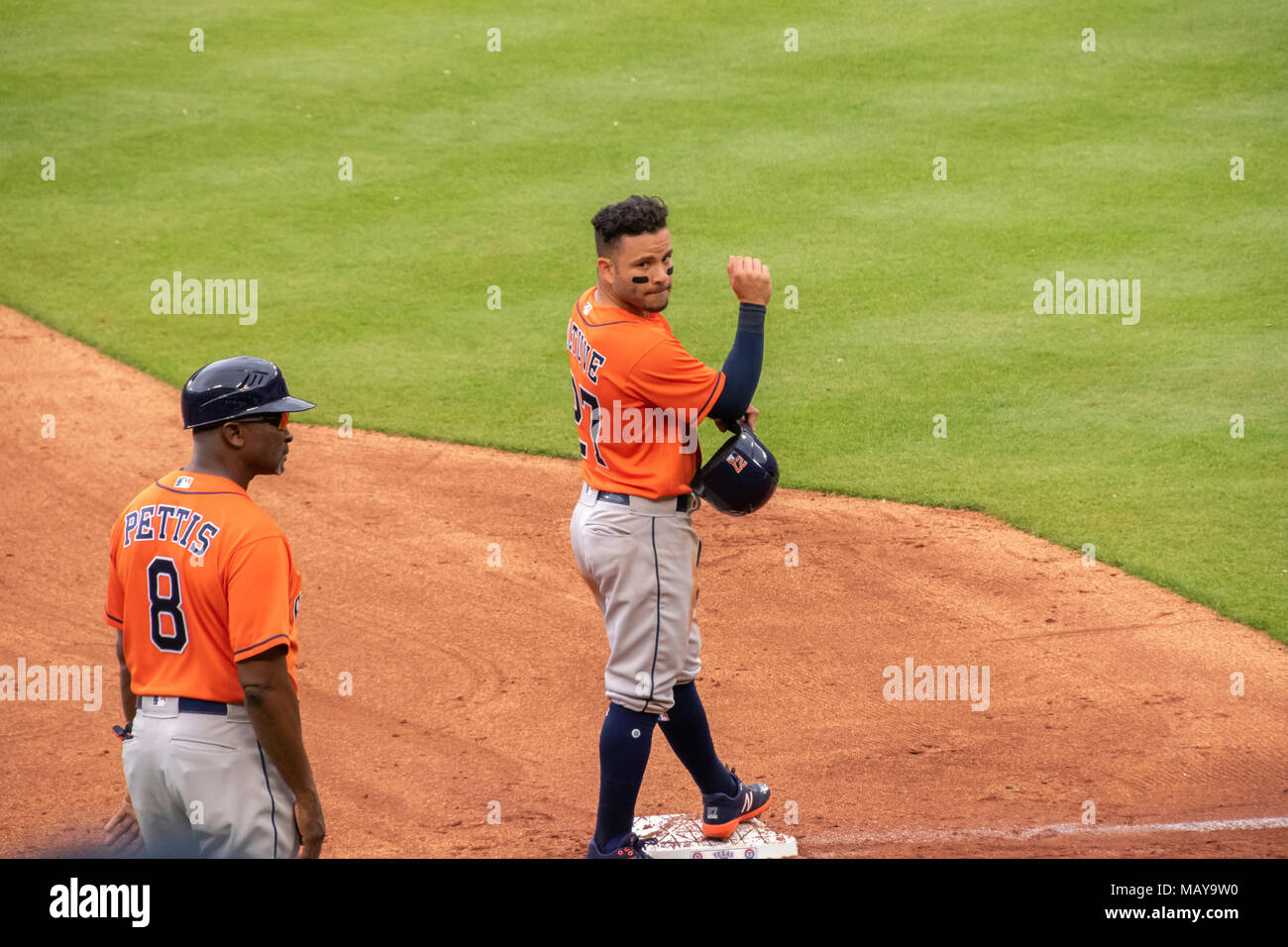 Houston Astros second baseman Jose Altuve stands at third base in game four of the season opener against the Texas Rangers. Astros won the series 3-1. Stock Photo