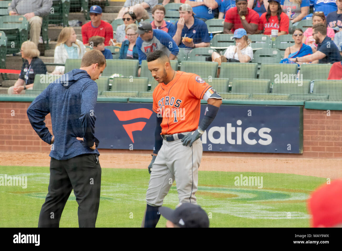 Astros short stop Carlos Correa being examined after being struck on the foot during a pitch against the Texas Rangers in Game Four of the season open. Stock Photo