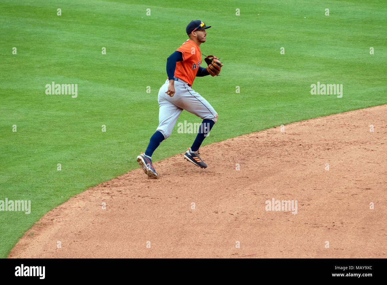 Houston Astros short stop Carlos Correa running to make plays against the Texas Rangers in Game Four of the season opener. Astros won the series 3-1. Stock Photo