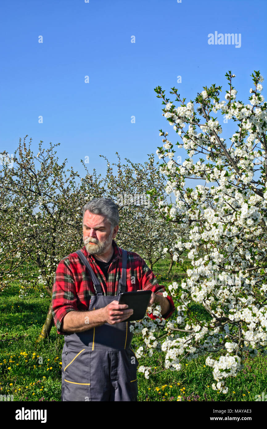 Farmer in coveralls hi-res stock photography and images - Alamy
