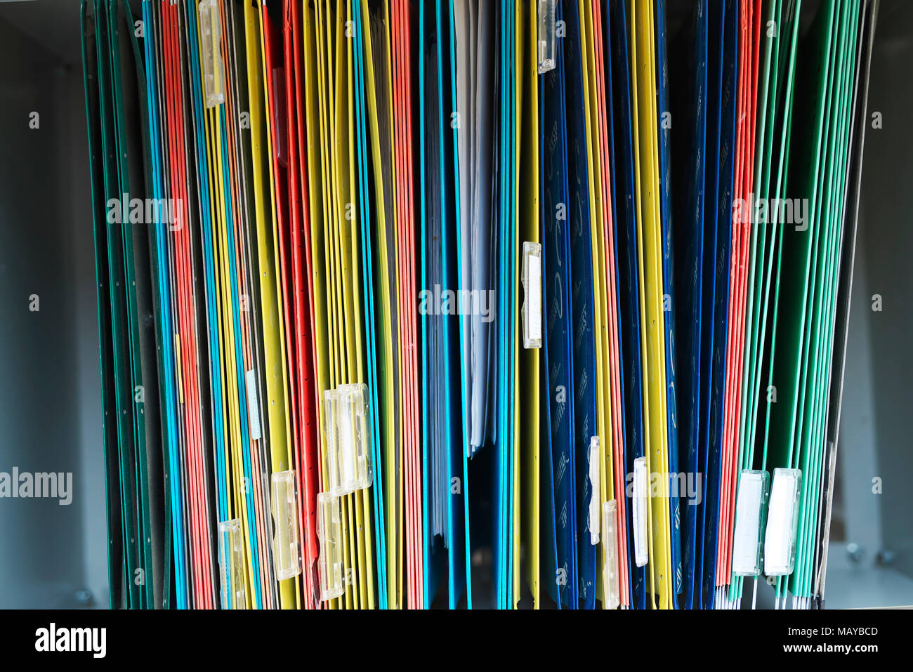 Files in an office filing cabinet stacked with personal information ...