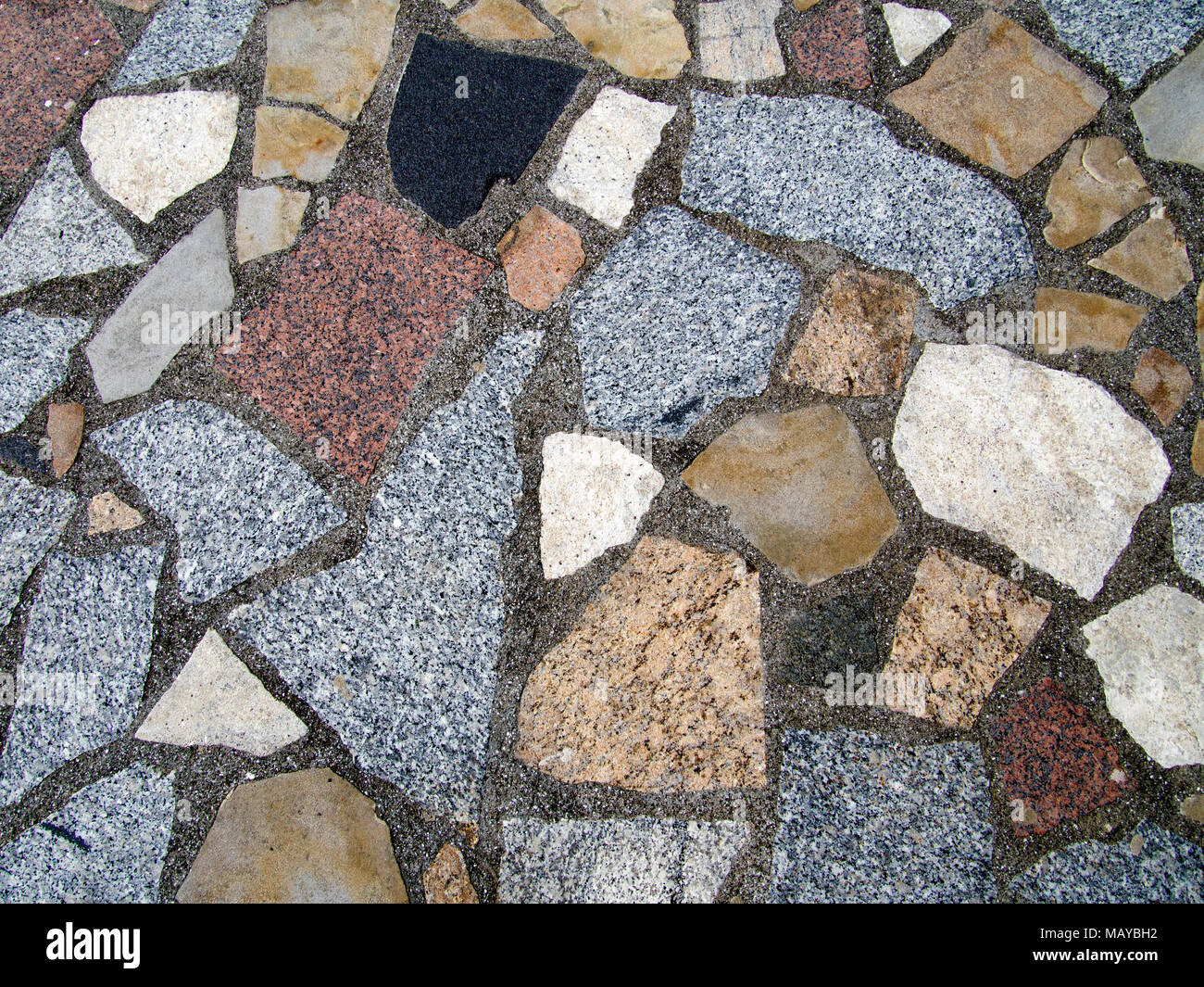 Crazy paving stonework. Pleasing colours. Stock Photo