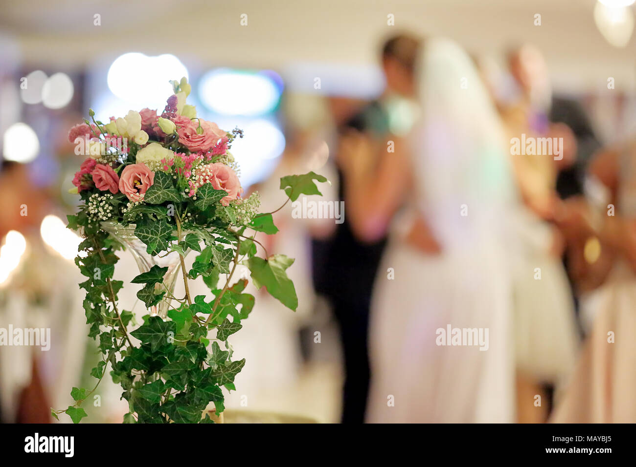 Newlywed couple dancing at wedding reception Stock Photo