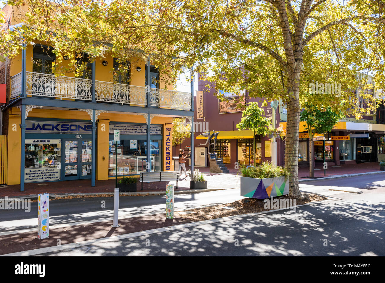 Historic buildings along the Plane tree shaded shopping and cafe strip