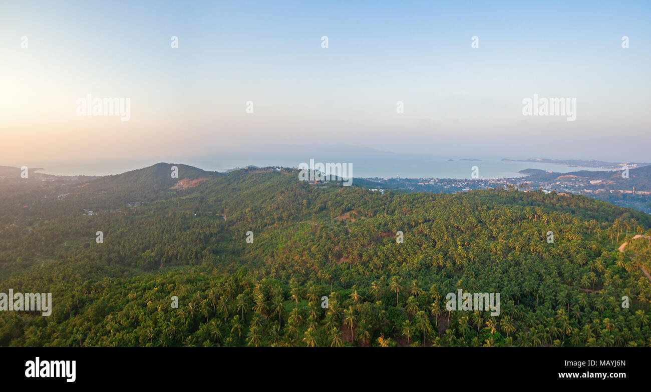 Aerial view of sunset over mountain jungle Stock Photo
