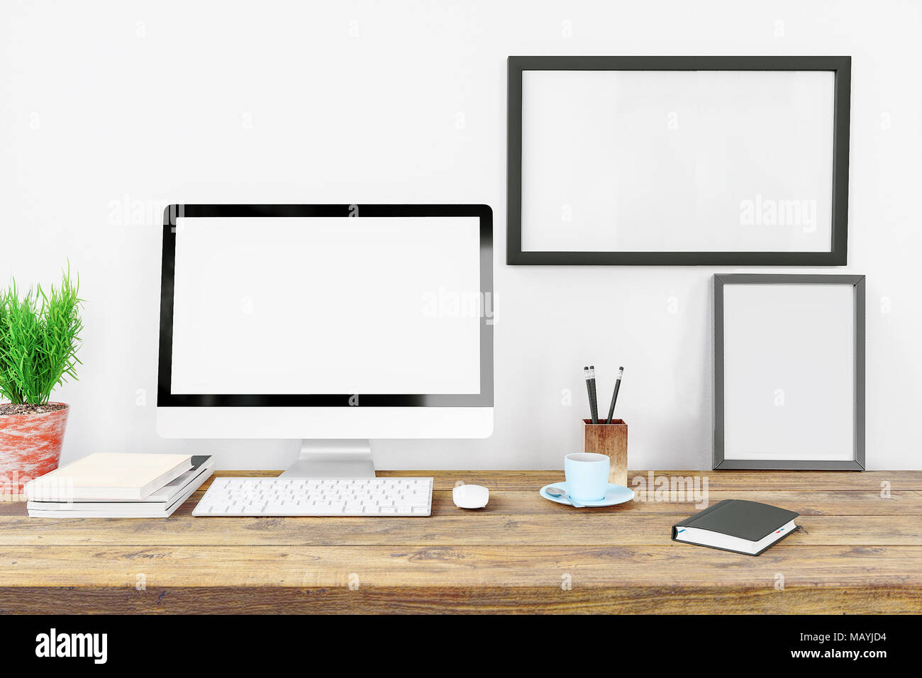 Computer display blank screen and office tools on desk in modern ...