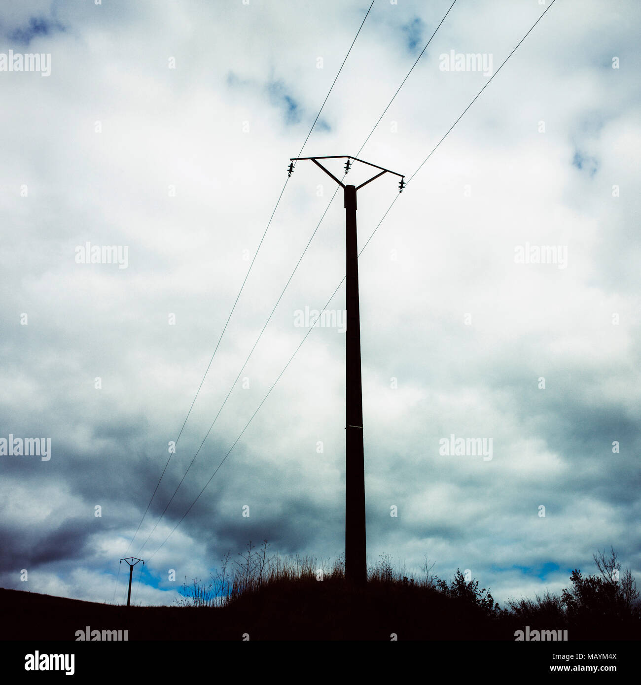 Electric pylon in nature and cloudy sky. France Stock Photo - Alamy