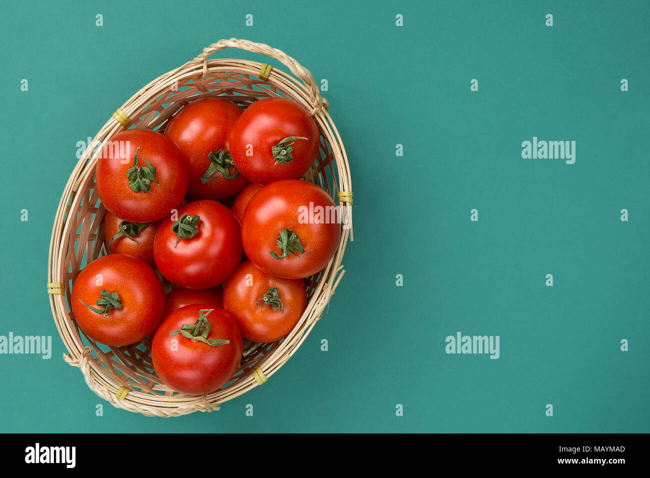 Fresh Ripe Organic Red Tomatoes in Wicker Basket on Turquoise Green ...