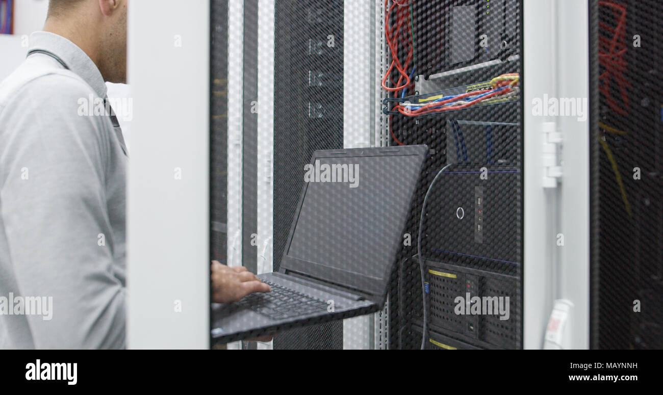IT expert checking supercomputer server Stock Photo