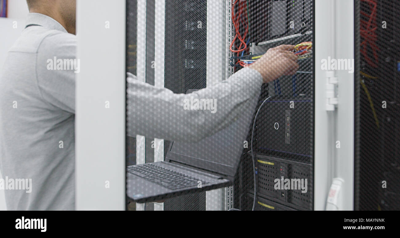IT expert checking supercomputer server Stock Photo