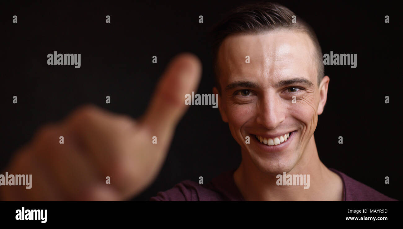 Smiling young black man face hi-res stock photography and images - Alamy