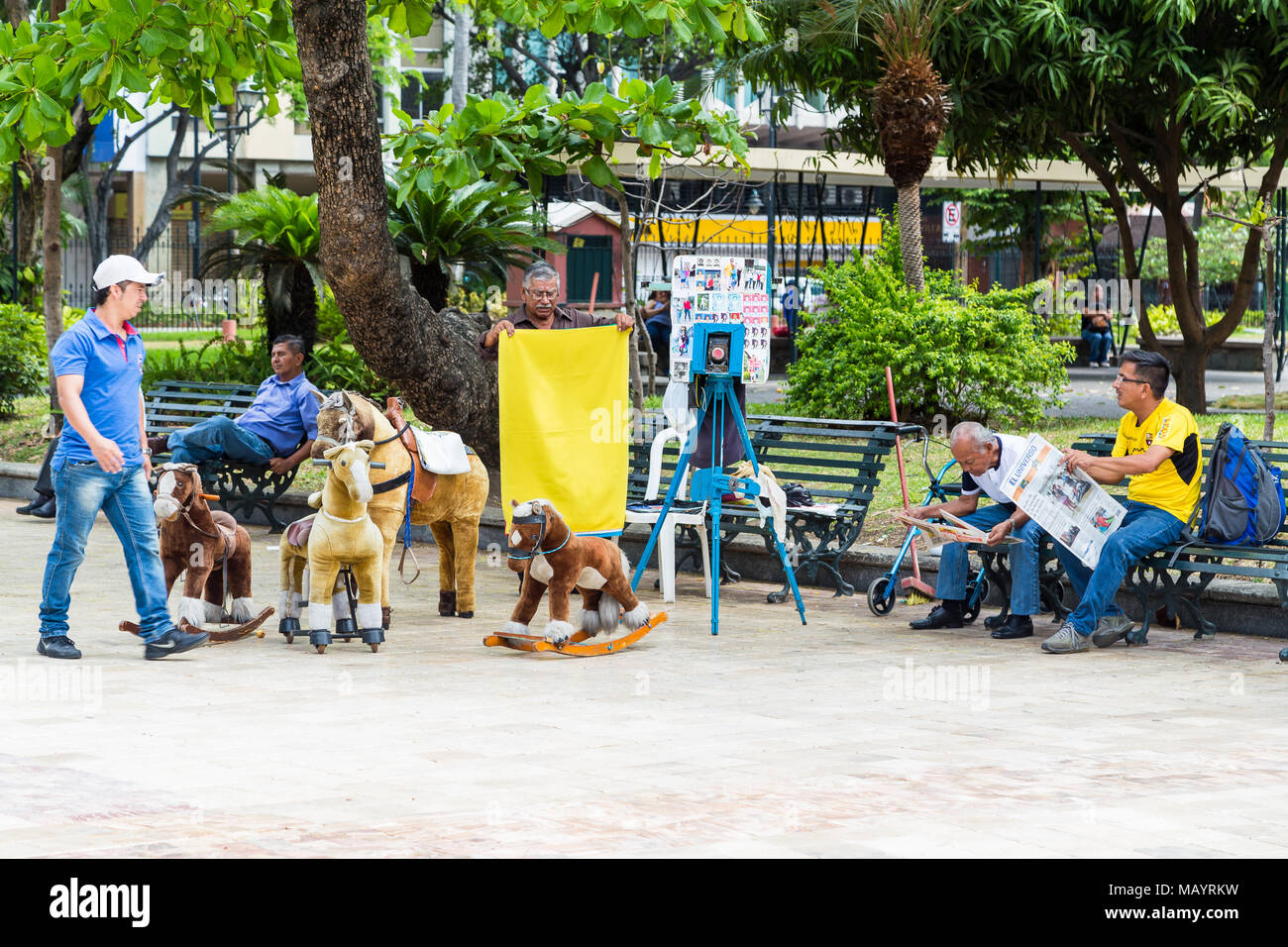 Guayaqil, Ecuador, December 20, 2016: An artisan photographer who makes portraits to tourists who visit the Parque Centenario de Guayaquil, is a typic Stock Photo