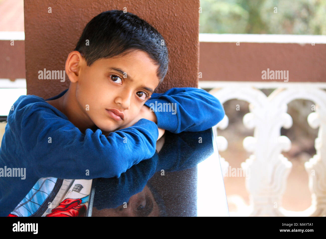 Little boy looking at camera with serious looks at Palande, Kokan Stock ...