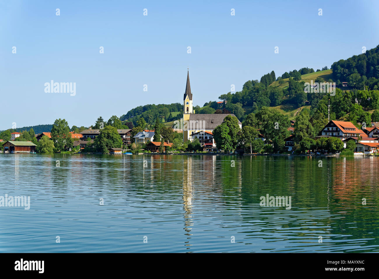 View over the Schliersee lake to the village Schliersee, with parish church St. Sixtus, Schliersee, Upper Bavaria, Bavaria Stock Photo