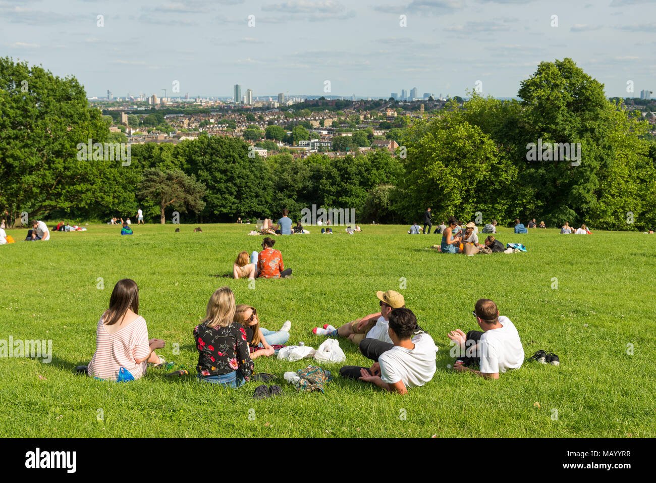 People relaxing in Alexandra Park overlooking North London, UK Stock Photo