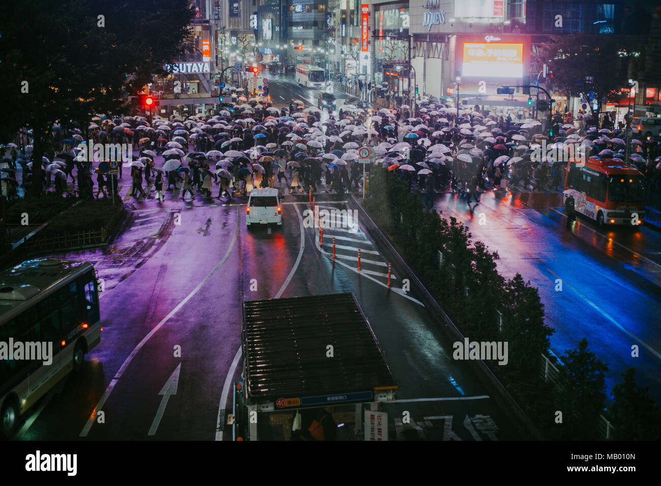 TOKYO, JAPAN -OCTOBER 20, 2017: Busy streets of Shibuya district in Tokyo at night, Japan. Shibuya is one of the shopping and financial districts Stock Photo